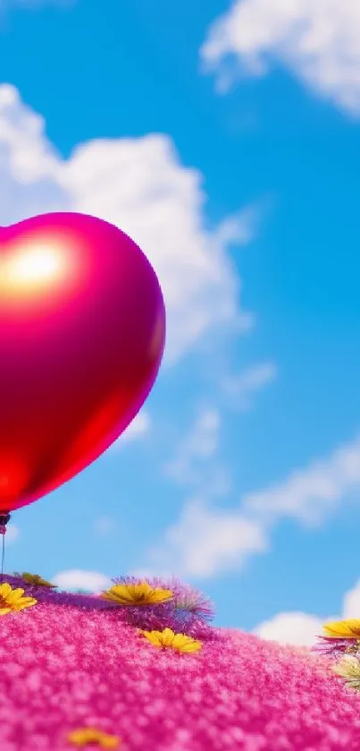 Heart-shaped balloon above a pink floral field under a blue sky.