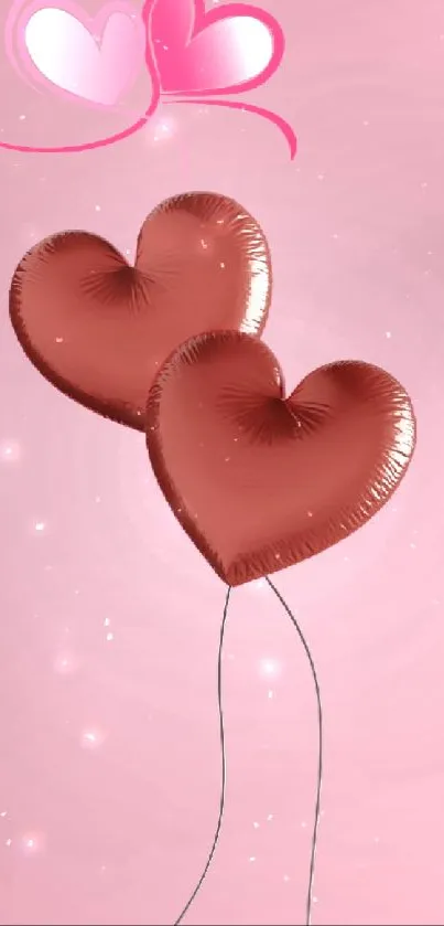 Two heart-shaped balloons on a pink background.