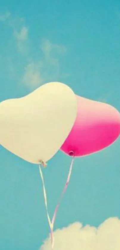 Heart-shaped balloons rise against a clear blue sky.