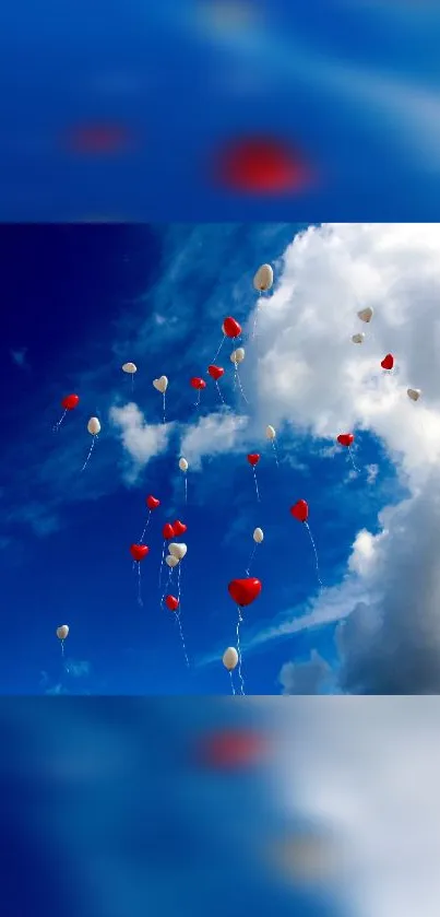 Heart-shaped balloons float across a blue sky with white clouds.