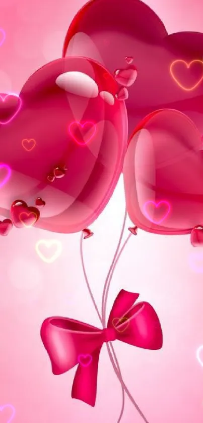 Pink heart balloons with bow on a soft background.