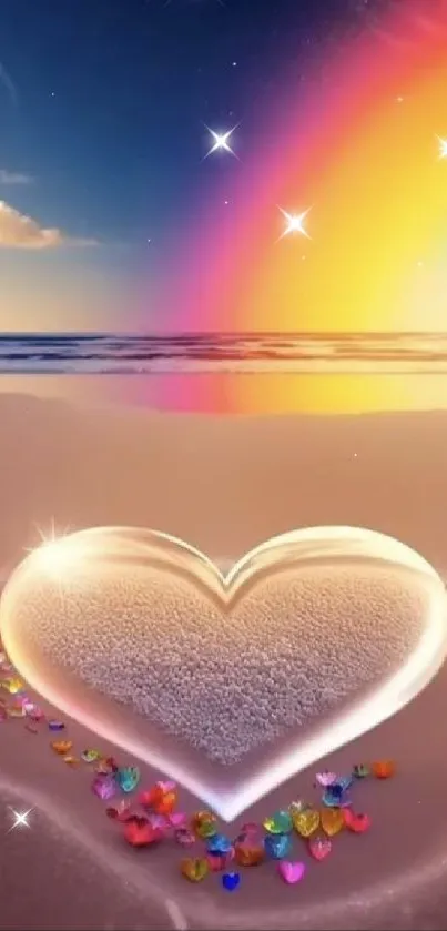 Heart in sand with colorful stones and rainbow over a beach at sunset.