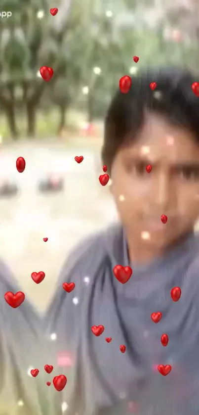 Blurred portrait with floating red hearts on a gray background.