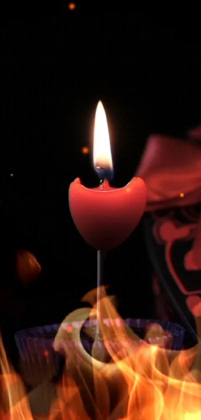 Heart-shaped candle with fire flames on black background.