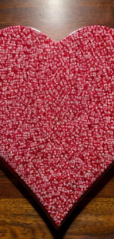 Heart-shaped candy pattern wallpaper with red and white sprinkles.