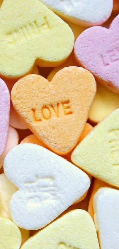 Colorful heart-shaped candies with sweet messages in pastel colors.