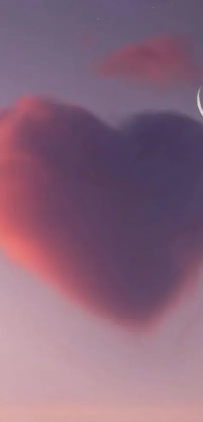 A heart-shaped cloud with crescent moon in a twilight sky.