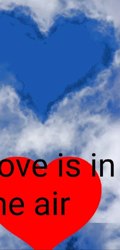 Blue heart in clouds with red heart and text 'Love is in the air'.