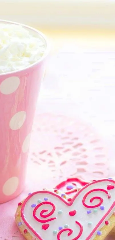 Pink heart cookies and coffee in polka dot cup.