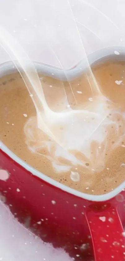 Heart-shaped red cup with creamy coffee splash.