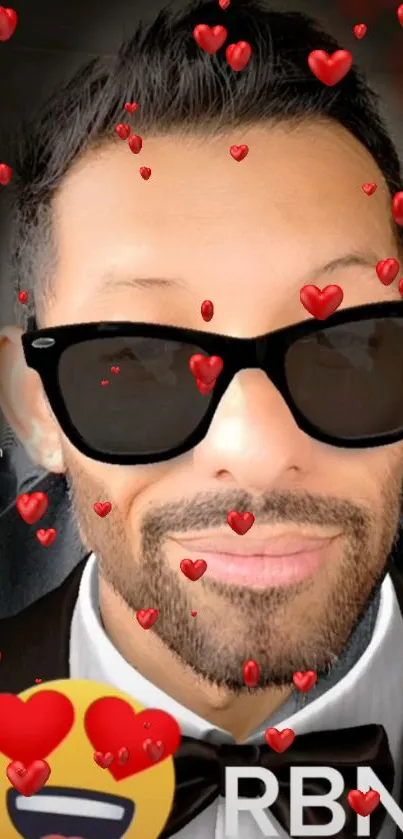 Man in sunglasses with floating red heart emojis on a stylish mobile wallpaper.