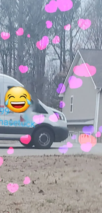 Van with pink heart emojis and laughing face, set in suburban scenery.