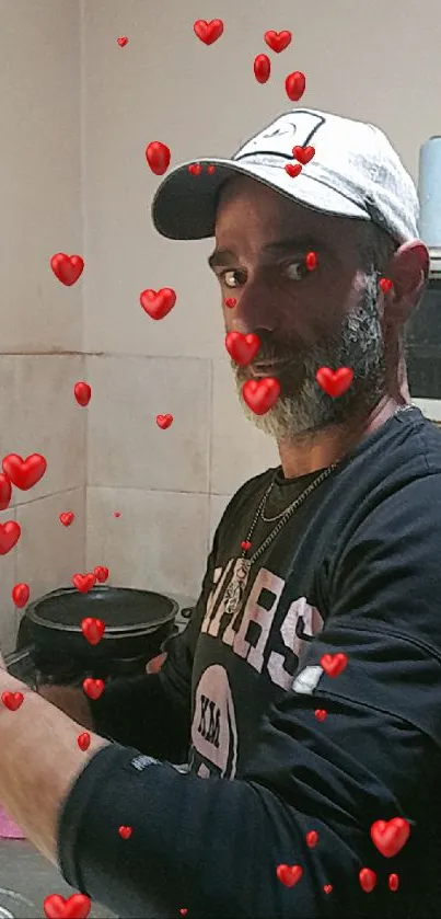 Casual man in kitchen with floating red hearts.