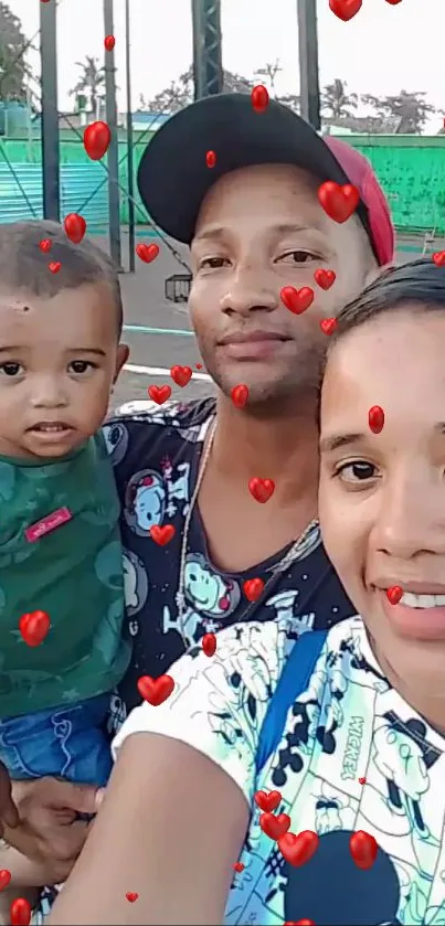 Family selfie with red heart decorations.