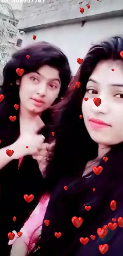 Two friends with red heart icons in a lively wallpaper.
