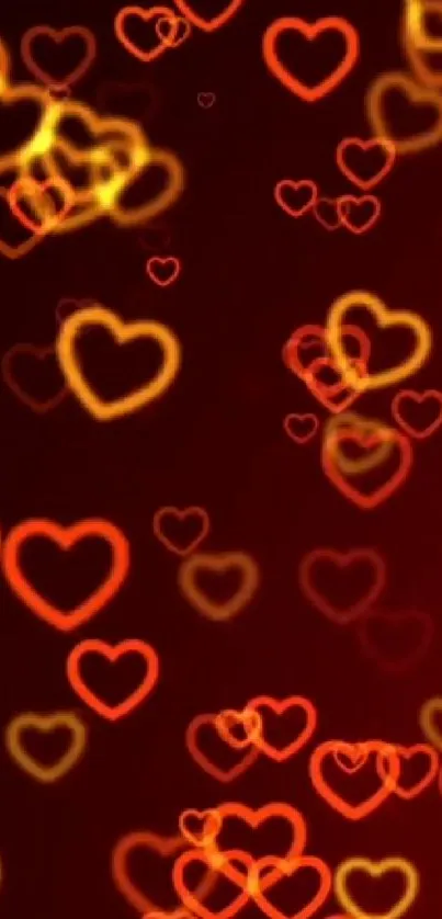 Vibrant red and yellow glowing hearts on a dark background wallpaper.