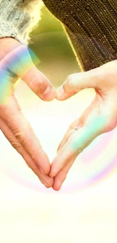 Hands forming a heart in a bubble with a warm background.