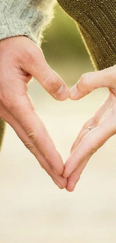 Heart-shaped hands forming a symbol of love with a beige background.