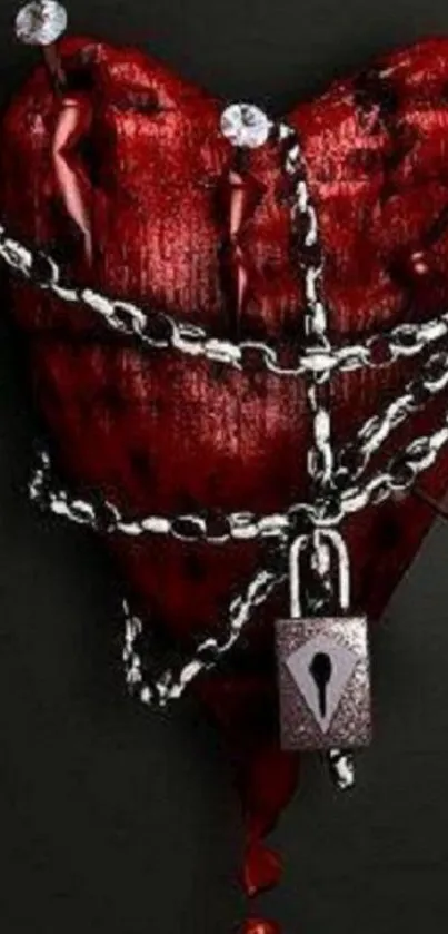 Red heart wrapped in chains with a lock on a dark background.