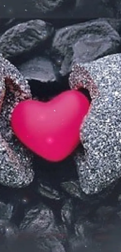 A bright heart emerging from grey stones against a dark background.