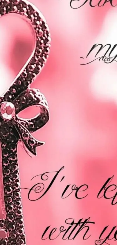 Romantic heart key in pink hues with decorative script on a mobile wallpaper.