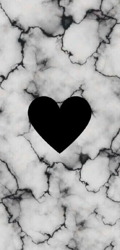 Black heart on marble background wallpaper.