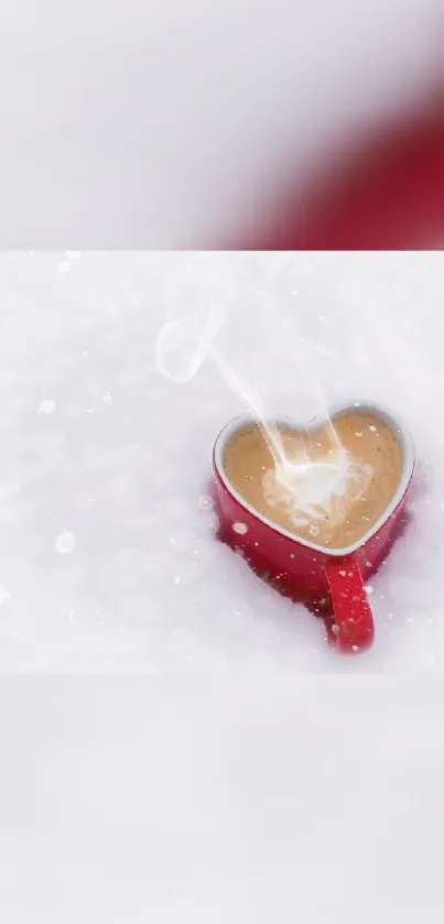 Heart-shaped mug with steam on snowy background.