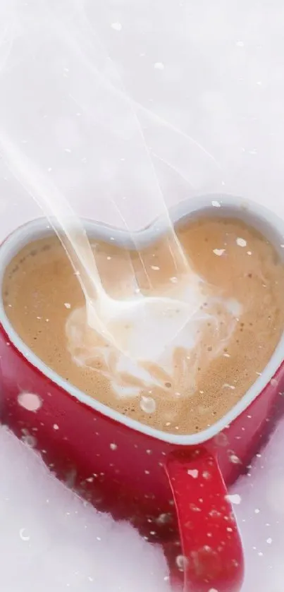 Heart-shaped mug in snow with steaming coffee.