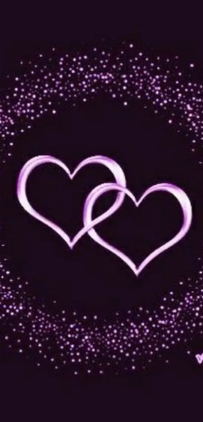 Purple intertwined hearts with sparkles on a dark background.