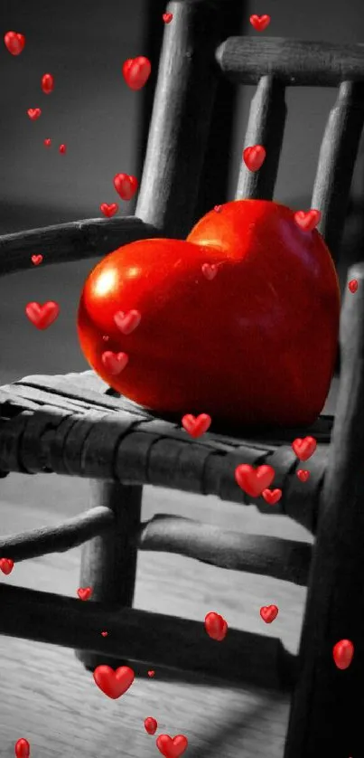 Red heart resting on a wooden chair in artistic wallpaper.