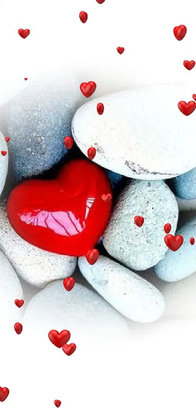 Red heart on smooth pebbles in minimalist wallpaper design.