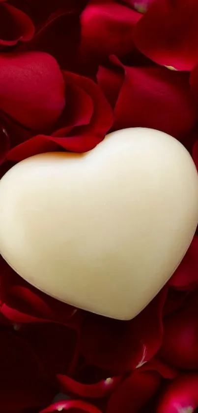 Heart on red rose petals wallpaper for mobile.