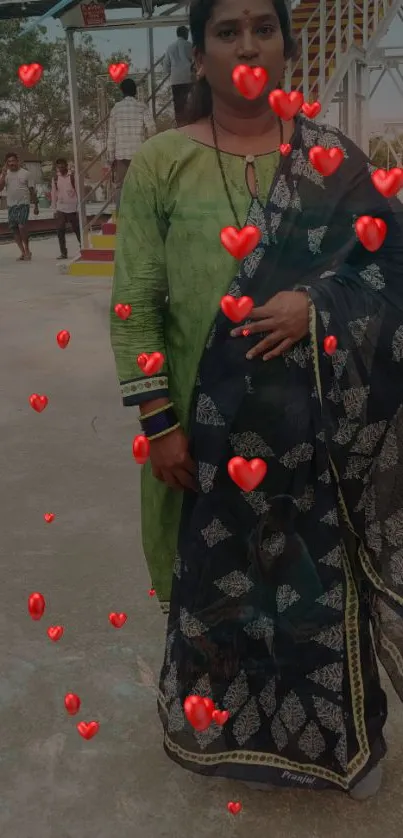 Woman in traditional outfit with red heart overlay wallpaper.