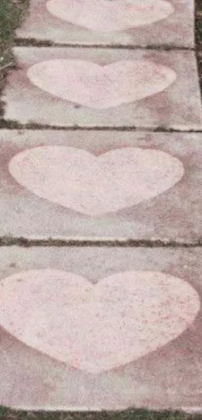 Heart-themed path with pink hearts on stone tiles.