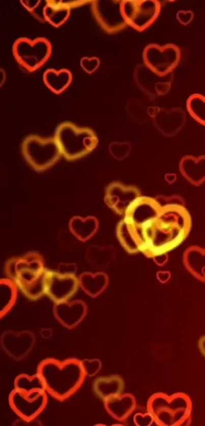 Mobile wallpaper with glowing red and yellow heart patterns.