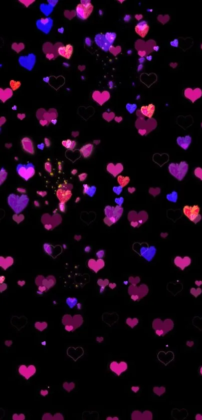 Mobile wallpaper with pink hearts on black.