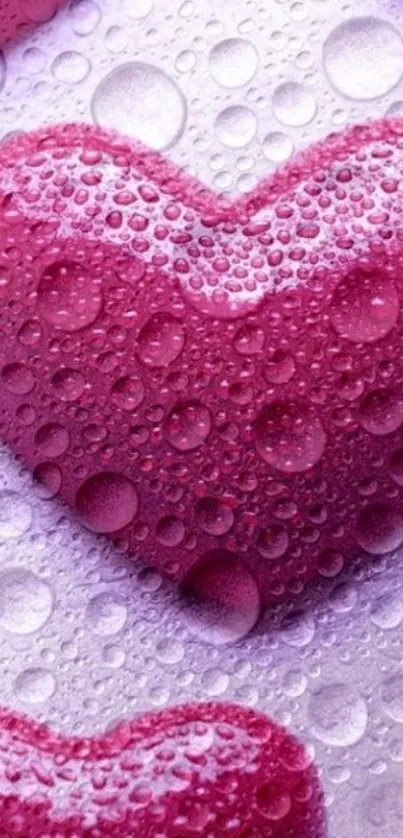 Pink heart wallpaper with water droplets for a textured, romantic design.