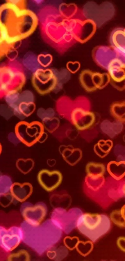 Vibrant heart-patterned wallpaper with glowing red and orange hearts.