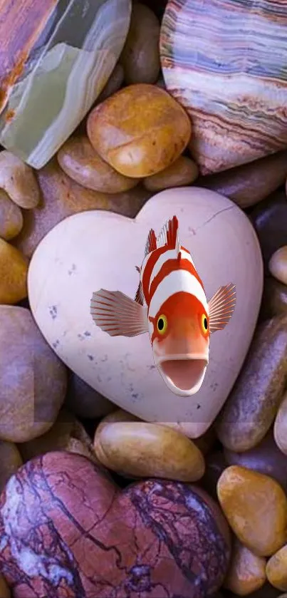 Heart-shaped stone with clownfish on colorful pebbles wallpaper.