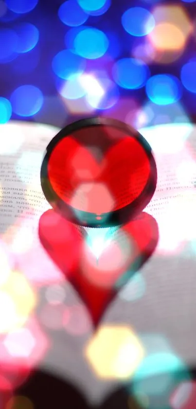 Red heart shadow on book with blue bokeh lights in the background.