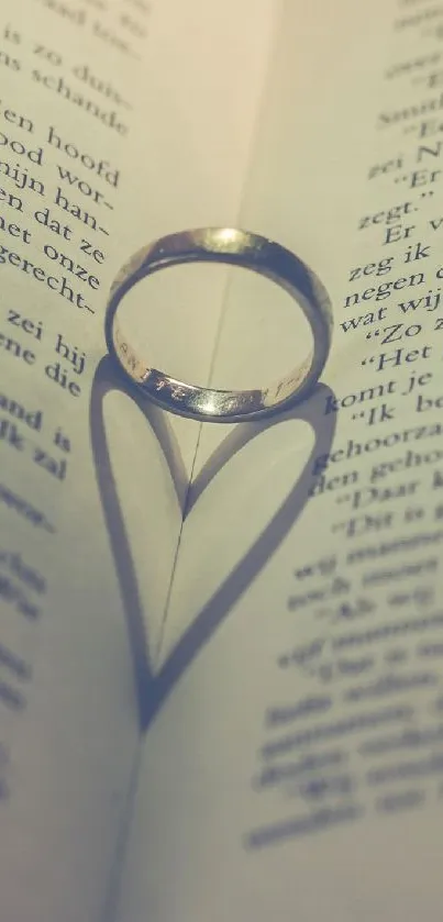 Gold ring casts heart shadow on a book page.