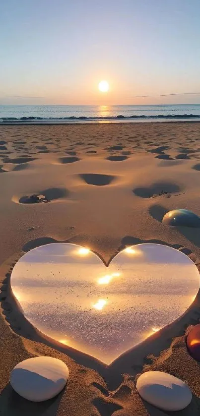 Heart in sand with sunset reflecting on beach.