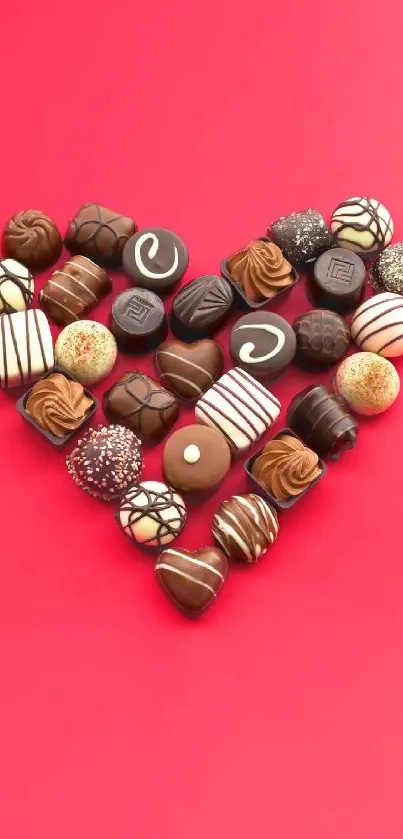 Heart-shaped chocolate collection on bright red background mobile wallpaper.