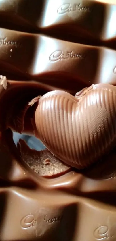 Heart-shaped chocolate on wavy bar background.