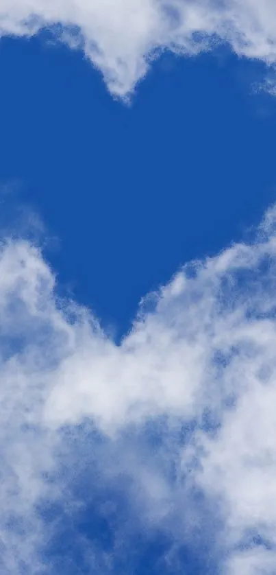 Heart-shaped cloud in a vibrant blue sky.