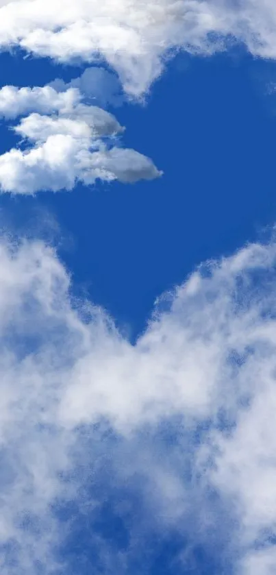 Heart-shaped cloud set against a vivid blue sky.