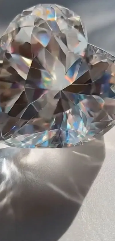 Heart-shaped crystal reflecting colorful light elegantly.