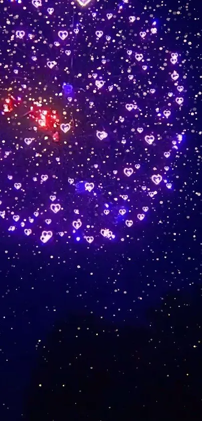 Heart-shaped purple fireworks light up the night sky in a stunning display.