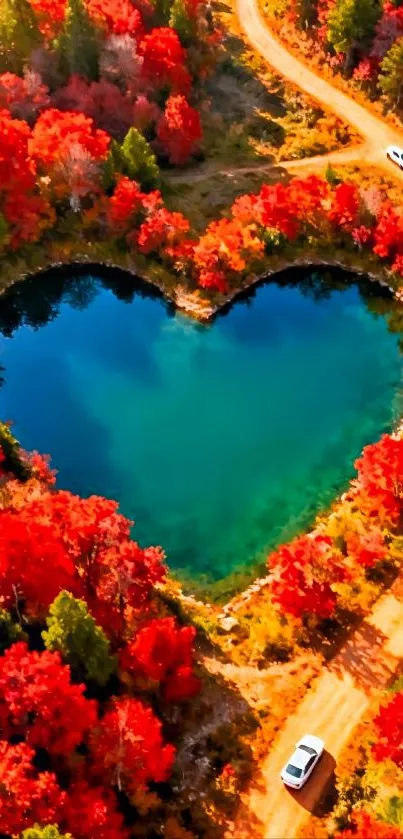 Heart-shaped lake with vibrant red foliage in autumn.