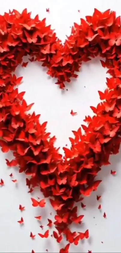 Heart-shaped red butterflies on white background.